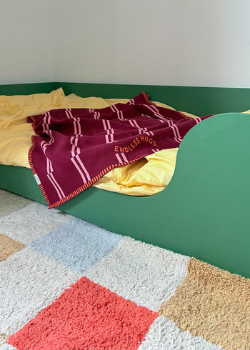 Cotton blanket for baby 80x100 cm in green dogs